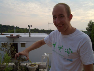 Jay holding the turtle living on the terrace